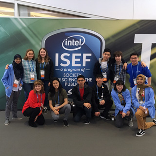Group photo in front of the Intel ISEF logo